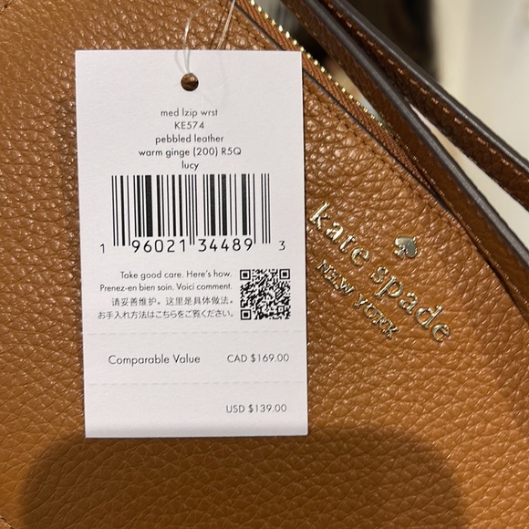Kate Spade Medium Lucy L-Zip Wristlet Pebble Leather 
COLOR
Warm Gingerbread
NWT - Picture 7 of 16